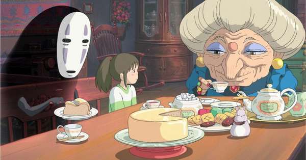 Image du Voyage de Chihiro représentant plusieurs personnages attablés autour de gâteaux
