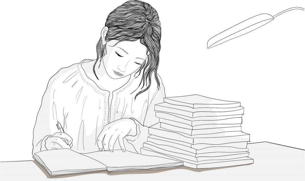 Une femme prend des notes à côté d'une pile de livres